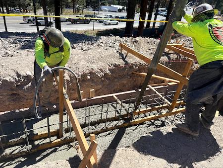 TROYCO Pouring Cement into footings for a commerical project in Mammoth Lakes, CA.